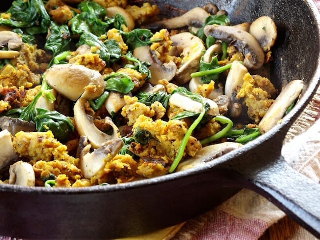 Savory chickpea flour scramble with mushrooms and spinach by Connoisseurus Veg.